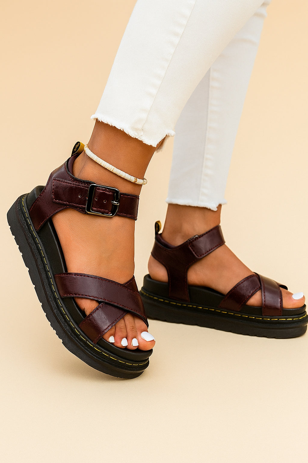 Close-up of platform sole and buckle strap on sporty sandals