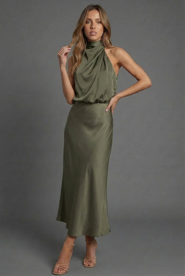 Halterneck satin style wedding guest midi dress, full length side view